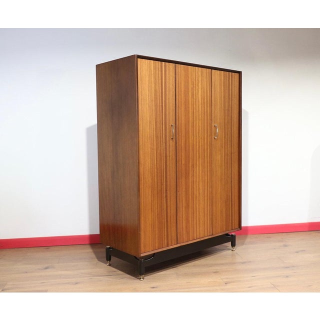 A stunning armoire by renowned British furniture maker G Plan as part of their Librenza range, this Mid Century Modern...