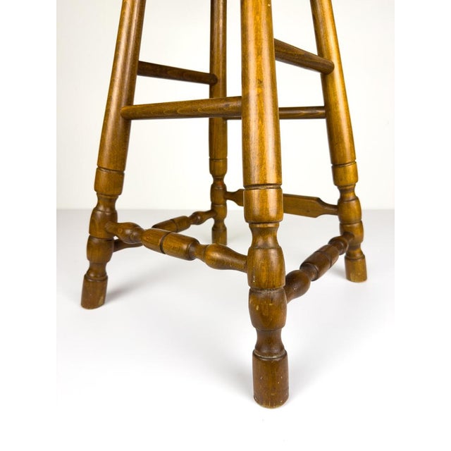 The beautiful wooden barstool made in Slovenia in 1992. Made of solid beech wood in the style of the Windsor chair....