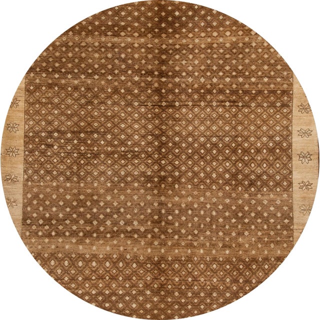 A beautiful 1950s vintage Turkish Anatolian Kars hand-knotted wool rug with a brown field and tan accents in an all-over...