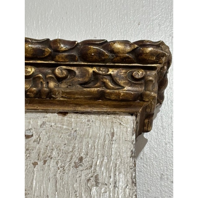 This wonderful trumeau mirror is a creamy Cole with aged gold finish. Hand carved floral carving, scrolled details, all...