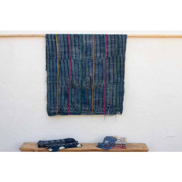 A masterwork of Malian textile heritage featuring deep indigo saturation and symbolic geometric motifs. Originating from...