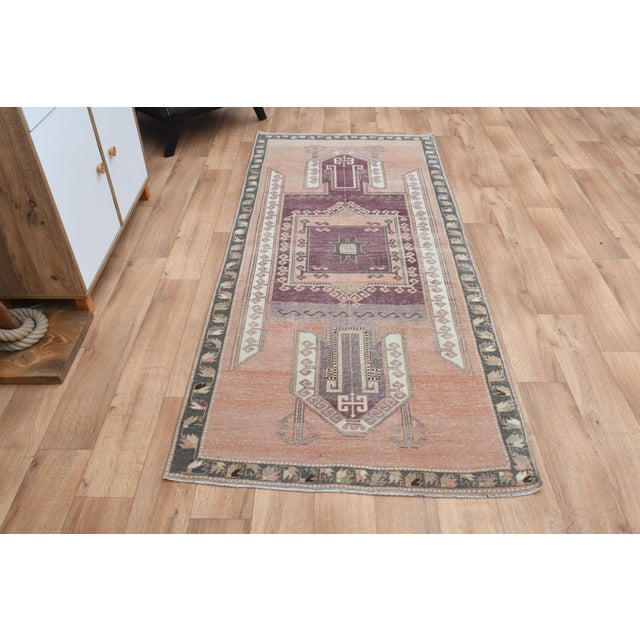 Vintage Turkish Hand-Knotted vintage rug is a semi-antique vintage runner rug. The '70s Eastern region of Turkey's unique...