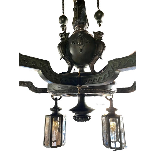 This fixture comes from an estate in Tuxedo Park New York. Three petal form sockets and six single light lanterns with...