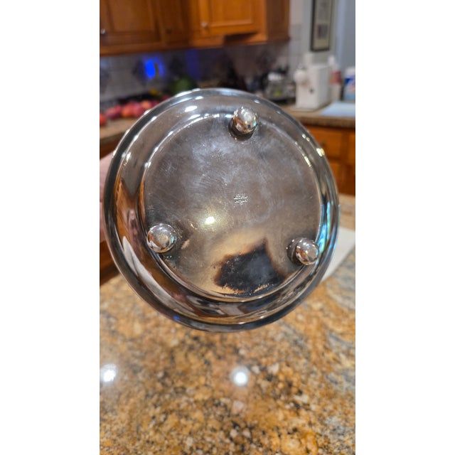 Vintage English Silver-plated hinged biscuit jar (Biscuit Barrel) featuring hand-chased floral repousse scrollwork and...