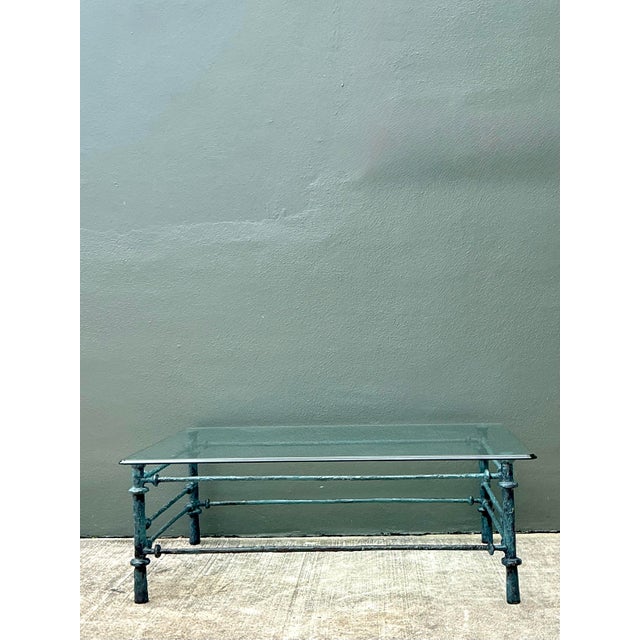 This striking wrought iron coffee table draws clear inspiration from the sculptural, spindly forms of Diego Giacometti....