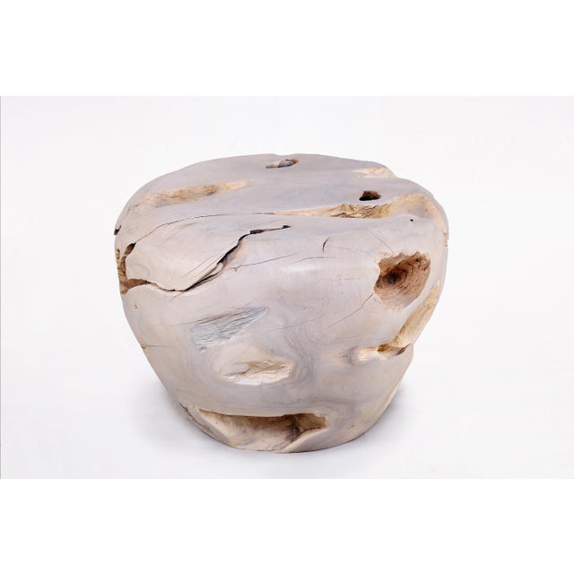 Inspired by the beauty of natural root form, this organic teak accent side table is handcrafted from one piece of salvaged...
