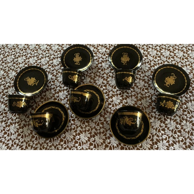 Set of 7 lacquer cups and saucers, 1960s Most likely turned wood, then lacquered black and hand-gilded. It's also possible...