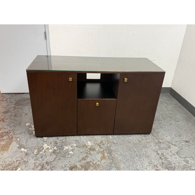 Design Plus Gallery presents a Bespoke Walnut Credenza by Lily Jack. This custom credenza has a wood case with a glass...