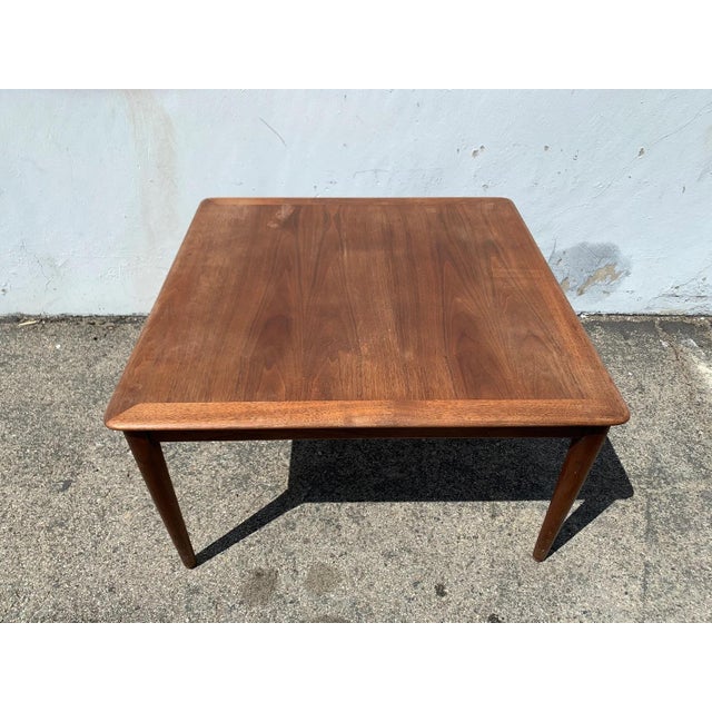 Great vintage mid century modern coffee table with a clean, square shape that is both appealing and versatile. Well...