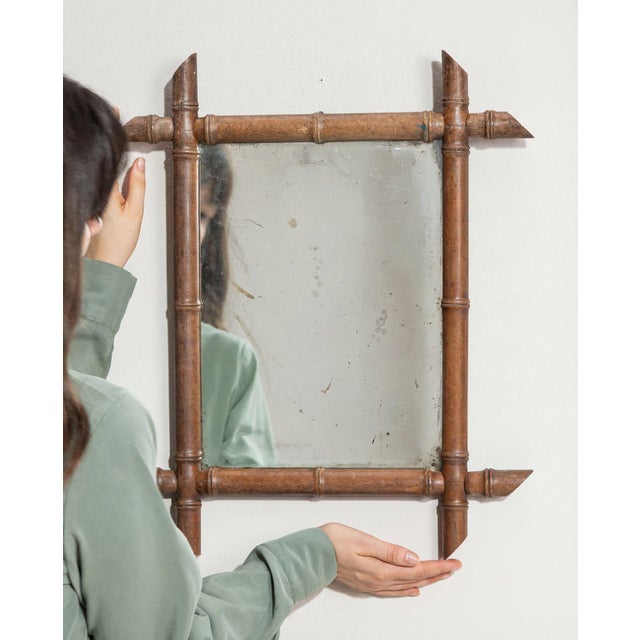 Here is a mirror, its faux bamboo, natural brown wood the first thing to catch the eye. Originating in France during...