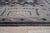 This gray wool rug features a hand knotted pile construction with a consistent allover pattern. Produced in India, the rug...