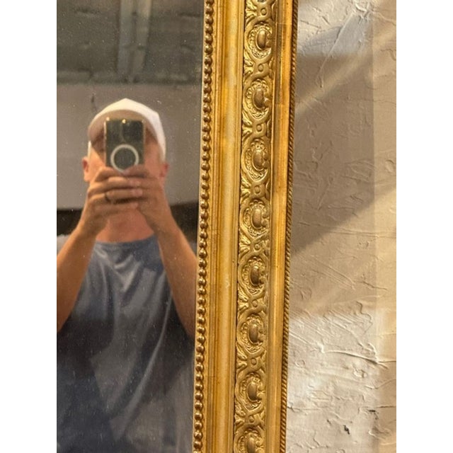 The 19th c. French Louis XV Giltwood Mirror is a stylish and elegant piece that can add a touch of charm to any room....