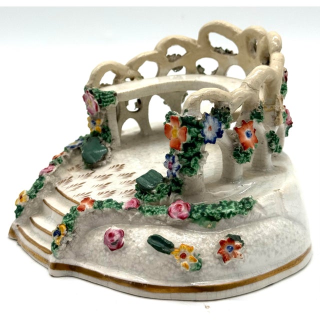 A charming 19th-century Staffordshire porcelain garden bower, delicately modeled with pierced trelliswork, a scalloped...