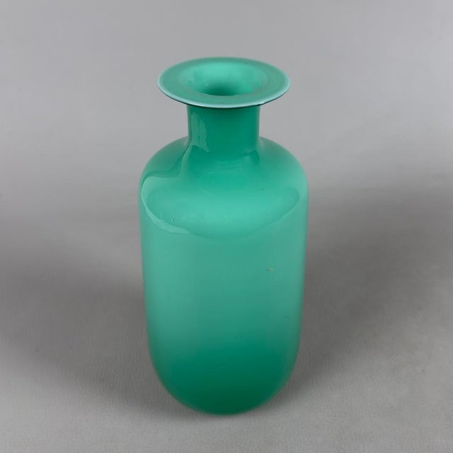 A collector's piece of vibrant beauty and absolute rarity. This superb Murano glass vase, signed by the prestigious De Wan...