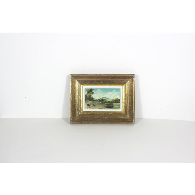 Vintage original painting of a landscape. Signed by the artist. The painting is mounted inside the frame. Some marks on...