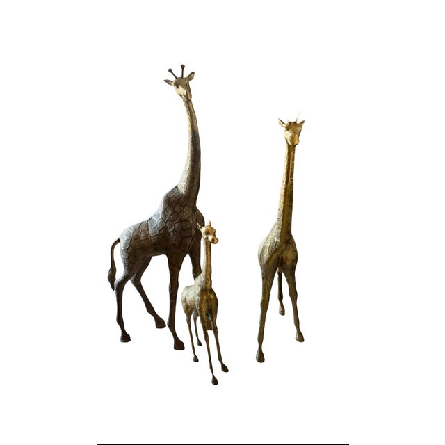 Stunning, rare 3-piece vintage family set of solid brass giraffe floor sculptures. These are iconic Mid-Century Modern /...
