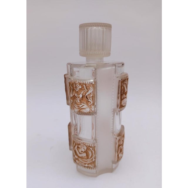 Lalique France perfume bottle Helene model Created on March 10, 1942, in a sepia patina, with figures of young women on...