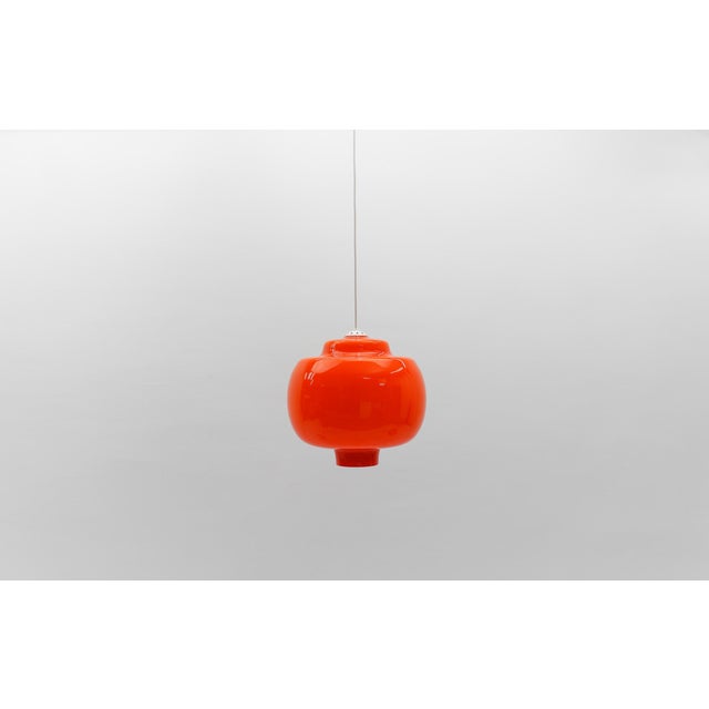Lovely orange glass ceiling lamp by peill & putzler, 1960s the lamp can be adjusted from 55cm to a height of 120cm. the...