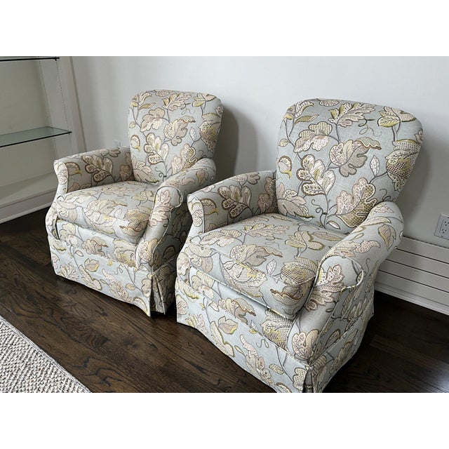 Elevate your living space with this charming pair of Craftmaster swivel armchairs, upholstered in a soft, linen-blend...