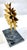 Vintage gold starburst metal table sculpture with dark blue, black, and light blue marble base. Depicts gold abstract...