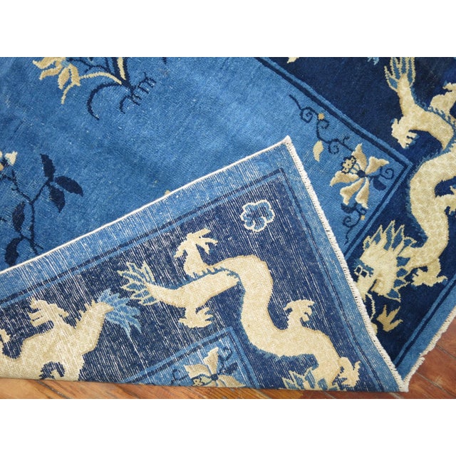 Very rare antique Chinese Peking runner with a pictorial dragon motif found in field and border in two shades of...