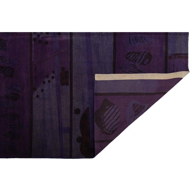 This striking contemporary Tibetan rug is a masterclass in textural depth and sophisticated color play. Hand-knotted by...