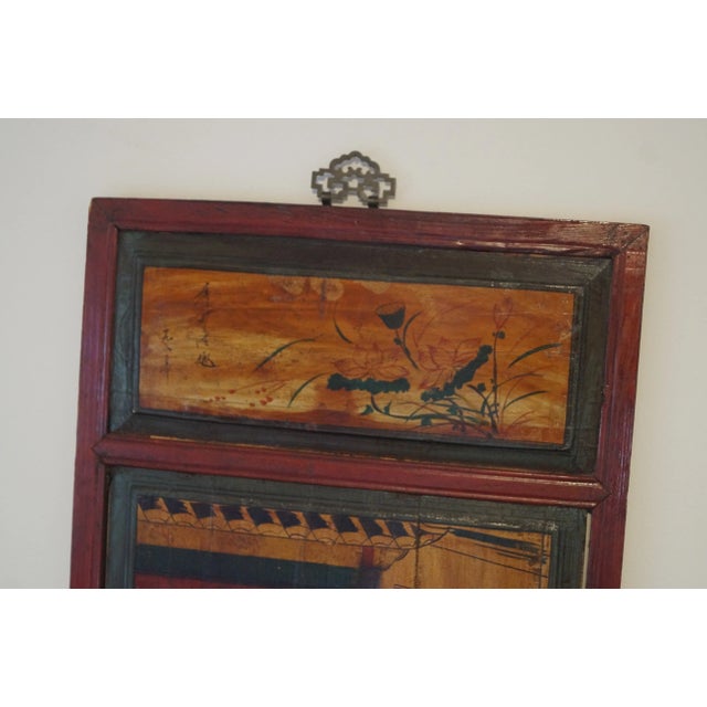 A large and beautifully old, hand painted Chinese panel which features figures and botanicals. This panel has an aged...