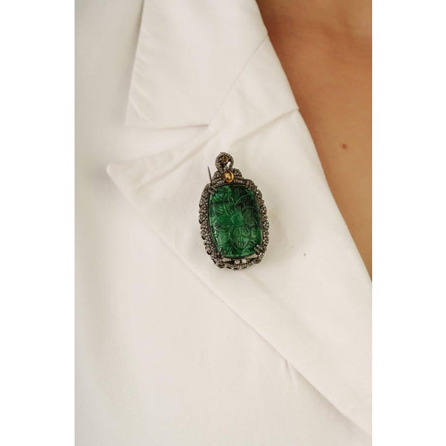 This exquisite emerald, citrine, and diamond brooch pendant is crafted in 925 sterling silver, featuring a beautifully...