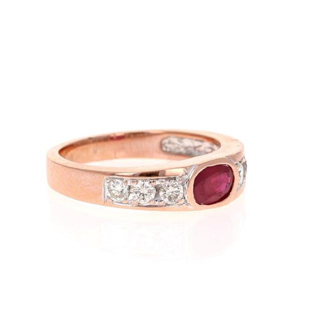 This unique band has 1 Oval Cut Ruby that weighs 1.00 Carats and 6 Round Cut Diamonds that weigh 0.37 Carats. The ring is...