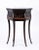 Neoclassical-style six-sided accent table featuring a rich dark brown finish and a timeless architectural silhouette. Its...