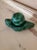 A beautiful, solid, hand carved and partially polished green malachite decorative stone/object/sculpture with a spherical...
