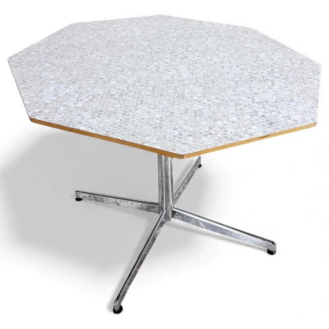 This mid century dining table features a striking octagonal formica kitchen table design with a textured formica top in a...