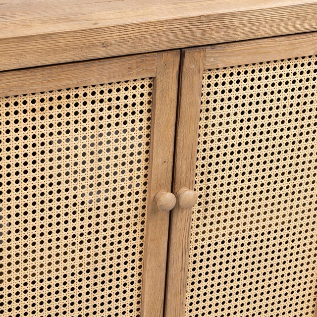 This striking 4-door sideboard combines the warmth of reclaimed pine with the natural texture of woven rattan for an...