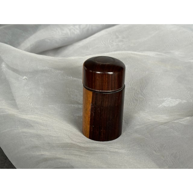 Designed to fit in a pocket, this antique Victorian era inkwell was handmade long ago from a single piece of wood. The...