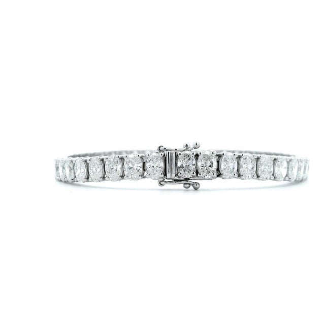 Stunning modern straight natural oval cut diamond tennis bracelet. Each stone GIA certified D-F color and VVS1-VS1...