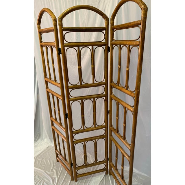 This light brown rattan room divider has a beautiful mid century feel that will add a touch of style and boho chic to your...