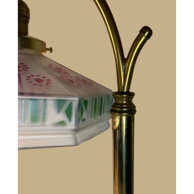 16.5” high, colorful shade with deco designs, all brass lamp which has movable joint so that shade can be in any position,...