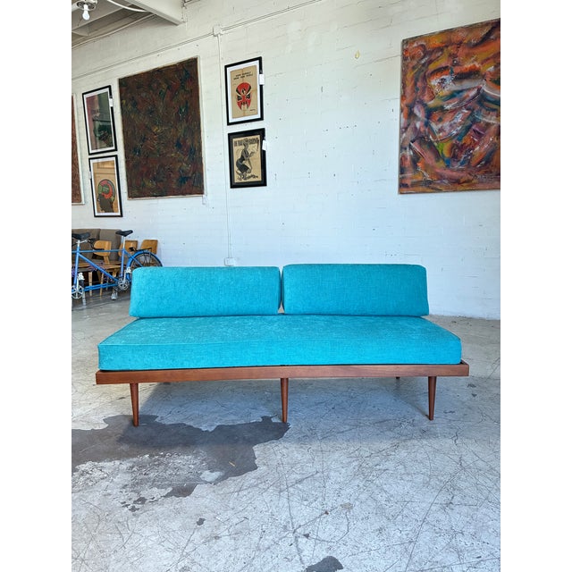 Gorgeous mid century modern daybed, newly upholstered in a soft teal fabric and newly refinished walnut frame. In...