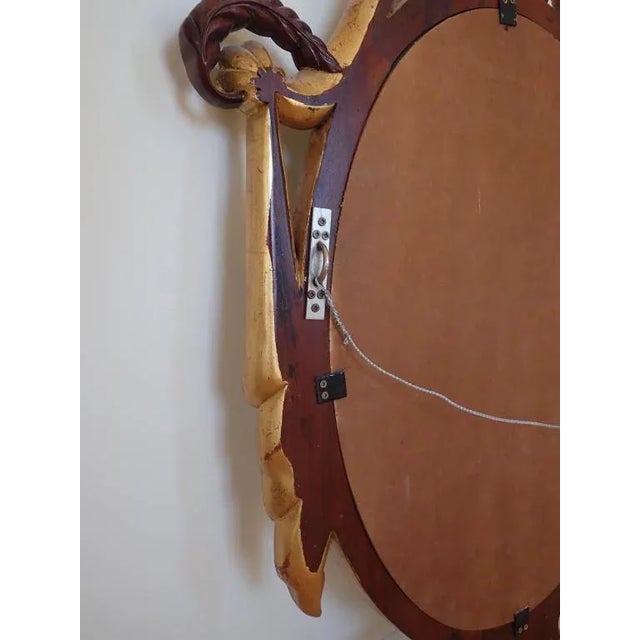 Large Hand Carved Mahogany and Gilt Maitland-Smith Wood Mirror. Beautiful classical designed frame with beveled glass....
