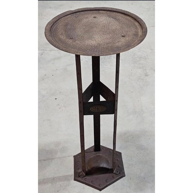 An elegant and highly collectible Arts & Crafts wrought iron side table, designed by the renowned German designer Hugo...