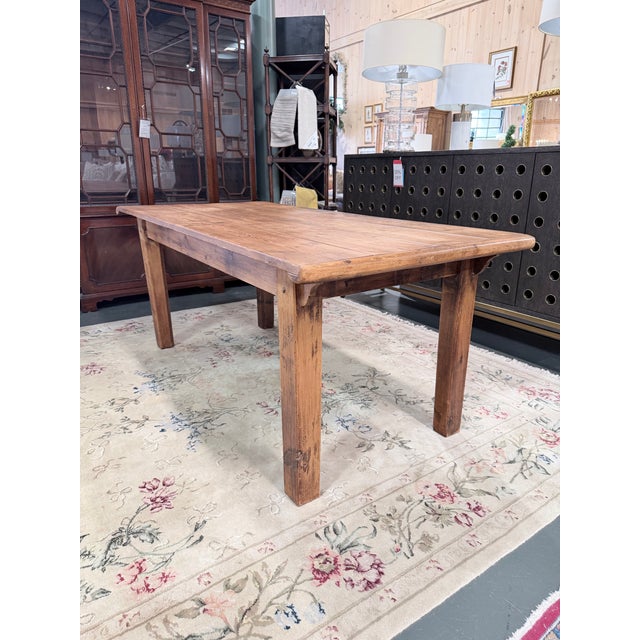 Rich in authentic character and rural craftsmanship, this antique primitive harvest table embodies the timeless appeal of...