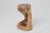 This biomorphic side table is a singular work of art, hand carved from a single hardwood log to achieve a perfect...