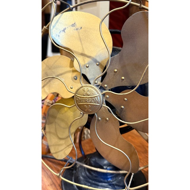 Beautiful antique Emerson Electric table fan featuring an elegant six-blade brass fan design with original brass cage and...