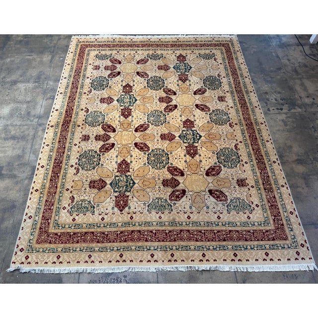 This vintage Lahore rug features a refined geometric medallion composition rendered in a warm, balanced palette of ivory,...