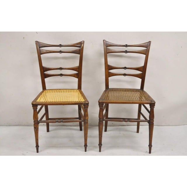 Antique Italian Biedermeier Arts & Crafts Walnut Bowtie Chiavari Side Chairs - a Pair. Chairs feature clean lines, turn...