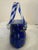 This Murano style blown art glass purse vase is a blue and green swirled body with transparent twisted candy cane style...