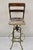 industrial Toledo Metal Co Steel and Wooden Adjustable Drafting Stool. Circa Early 20th Century. Measurements: 44" H x...