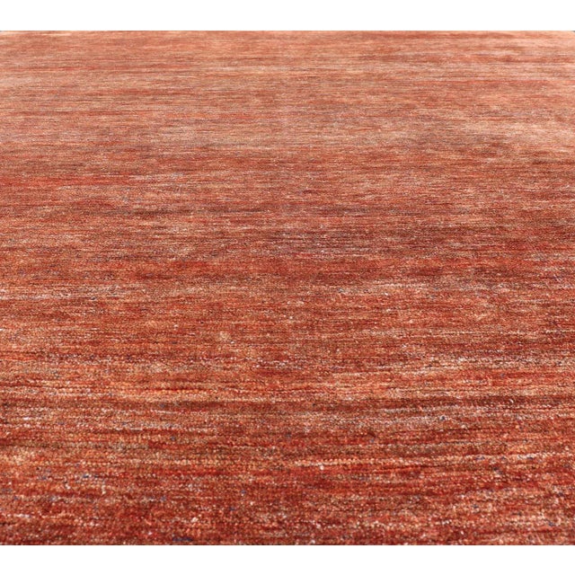 Measures: 9'5 x 12'2 Modern Solid Rug in Warm Burnt Orange Tones 9'5 x 12'2. Keivan Woven Arts / rug/ APE-7266, country of...