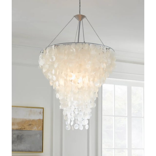 New Item. Row after row of glittering capiz shells dangle like exquisite jewels from this gorgeous chandelier, catching...