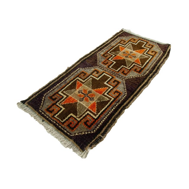 Vintage Handknotted decorative mini rug from Kars region of Turkey. Approximately 45-55 years old. In very good condition.